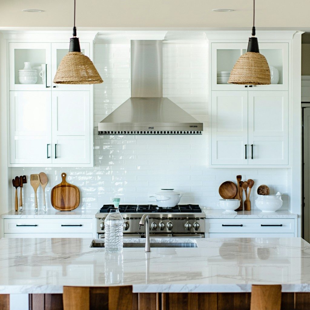 Modern kitchen remodel with white cabinets and stainless steel appliances