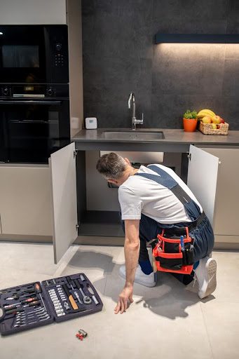 Kitchen renovation in progress with tools and materials