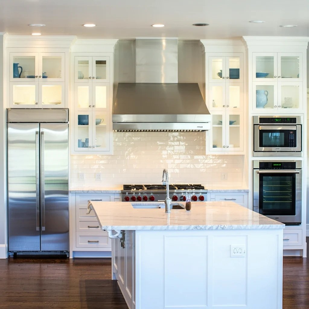 Modern kitchen remodel with white cabinets and stainless steel appliances