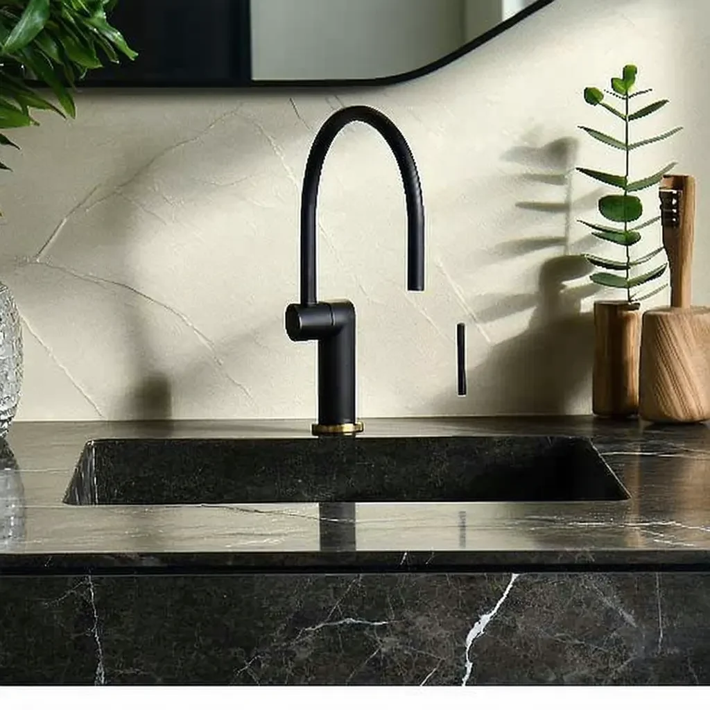Modern black integrated sink with a minimalist faucet.