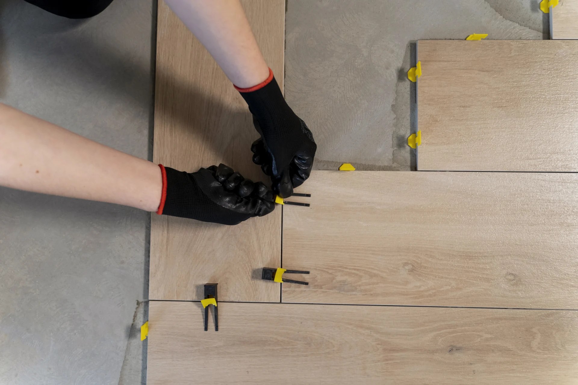 Engineered hardwood flooring being installed over prepared subfloor