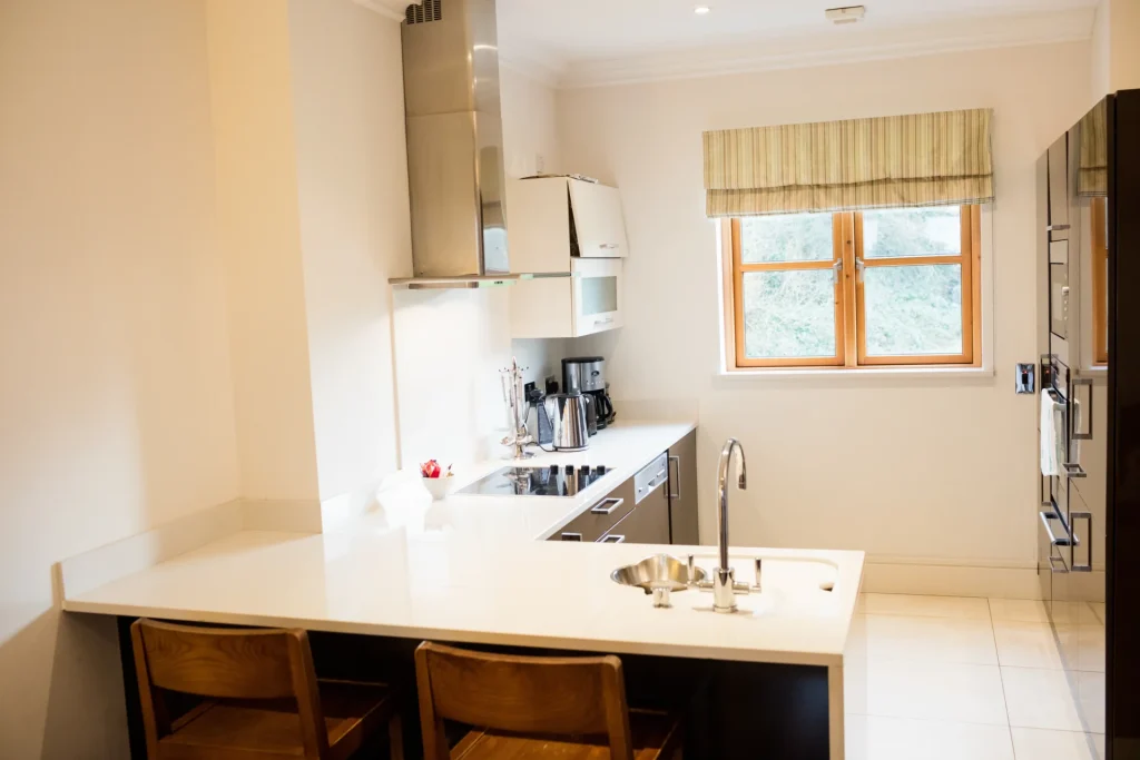 Bright kitchen renovation featuring a center island, modern cabinets, and stainless steel appliances