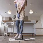 How to maintain new hardwood floors after installation. Newly installed hardwood floors in a modern living room with natural light and minimal furniture